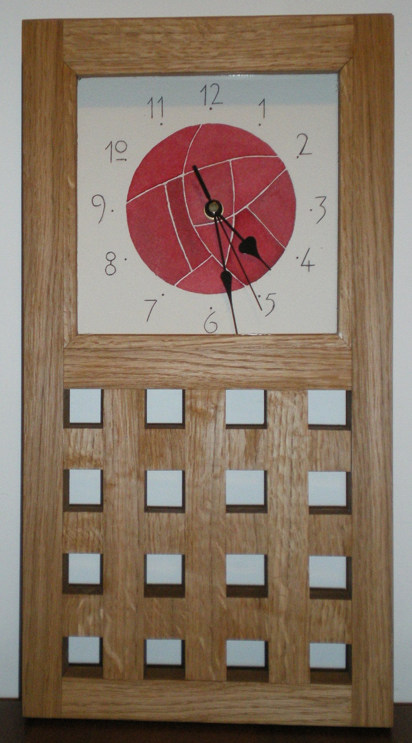 This Mackintosh style large lattice clock was commissioned for a Ruby Wedding and has a painted face based i=on the Mackintosh rose motif