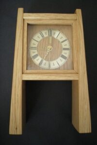 This is a mantle clock inspired by the furnature maker Krenov. It has a tapering design in the legs, an insert face and is made in oak.