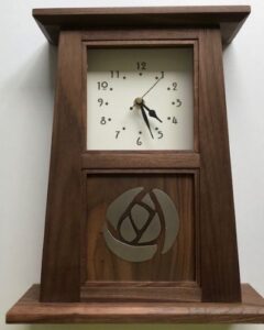 This American Black Walnut mantle clock has an inlayed pewter Mackintosh rose design.