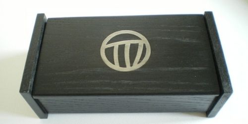 This small hinged box is made in black ash and it has a pewter Mackintosh rose inlay.