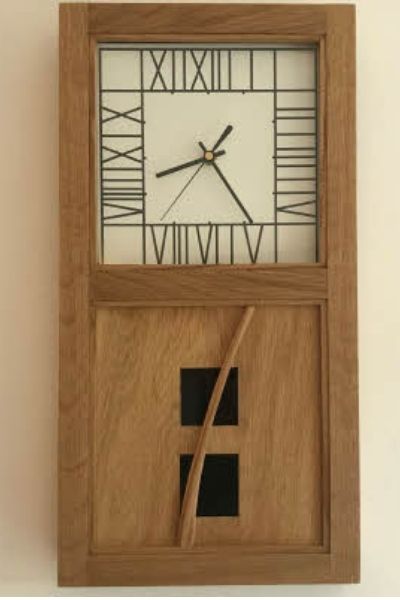 This is a large wall clock based on the Mackintosh reeds design in the Glasgow School of art library.