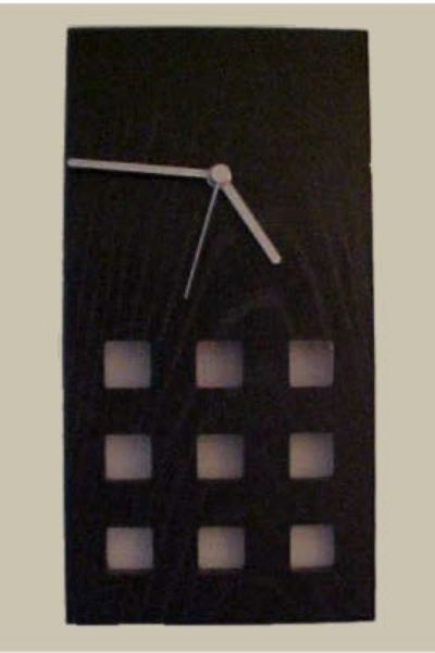 This is a Mackintosh inspired small lattice wall clock in black ash.