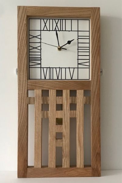 The design for this oak wall clock was based on a motif on the chair in the Willow Tearooms in Glasgow.