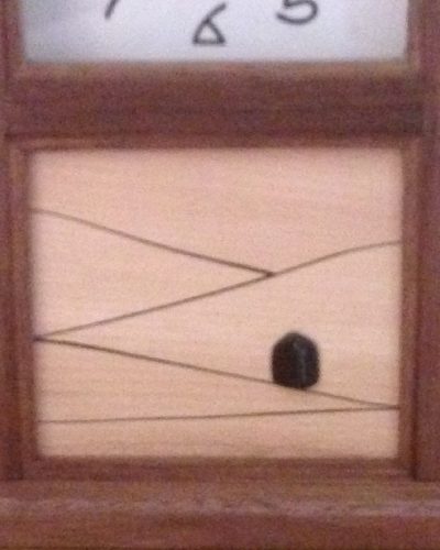 This is a close up of the panel in Arts and Crafts clock with the rosewood inlay and jet